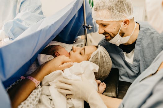 new parents smiling with their baby