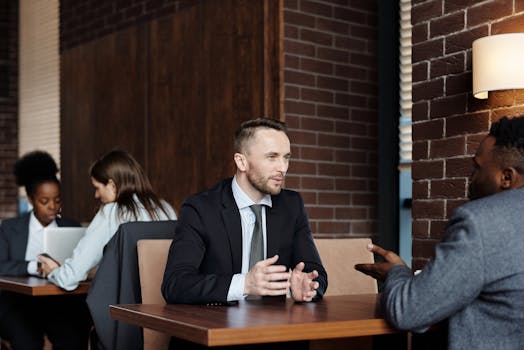 people discussing at a café