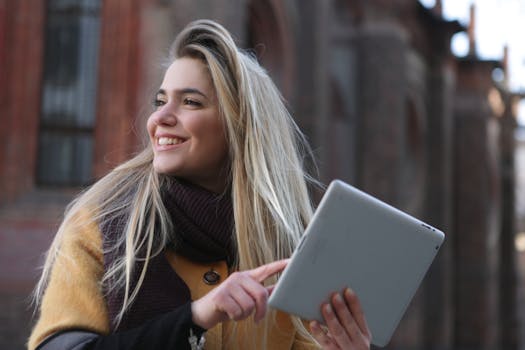 a photo of a young adult looking at their phone