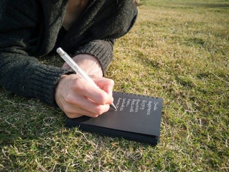 a person writing in a journal about their feelings