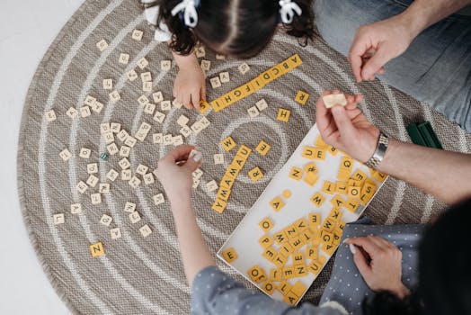 children playing board games with parents