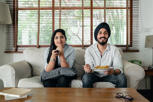 couple enjoying a movie night at home