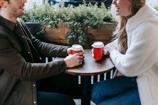 a couple happily interacting at a cafe